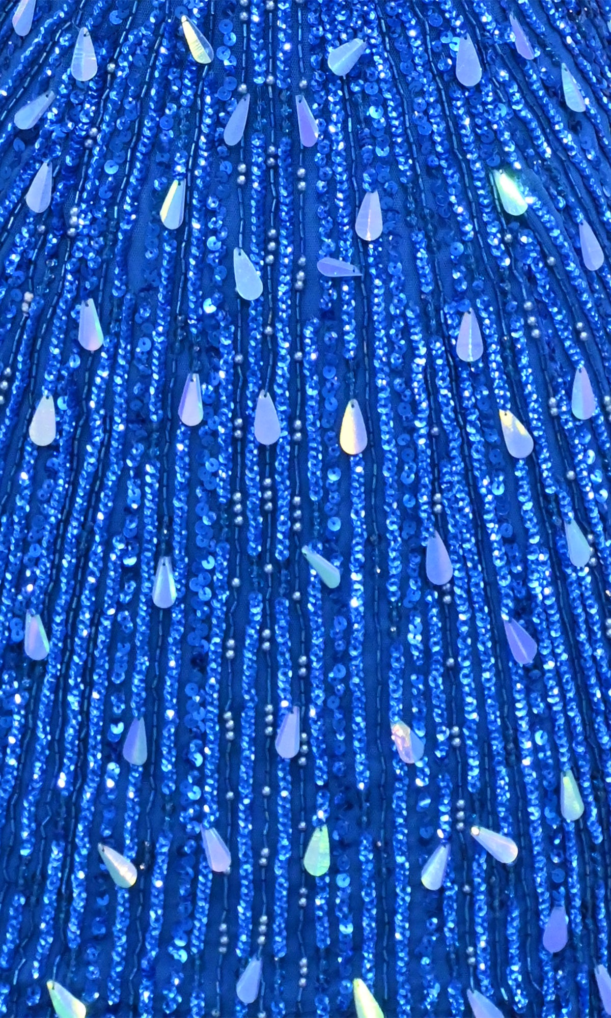 Close-up of the PromGirl Exclusive 250304S Mini Sequin Hoco Dress, featuring blue fabric with vertical rows of iridescent teardrop-shaped embellishments—perfect for a sexy homecoming look.
